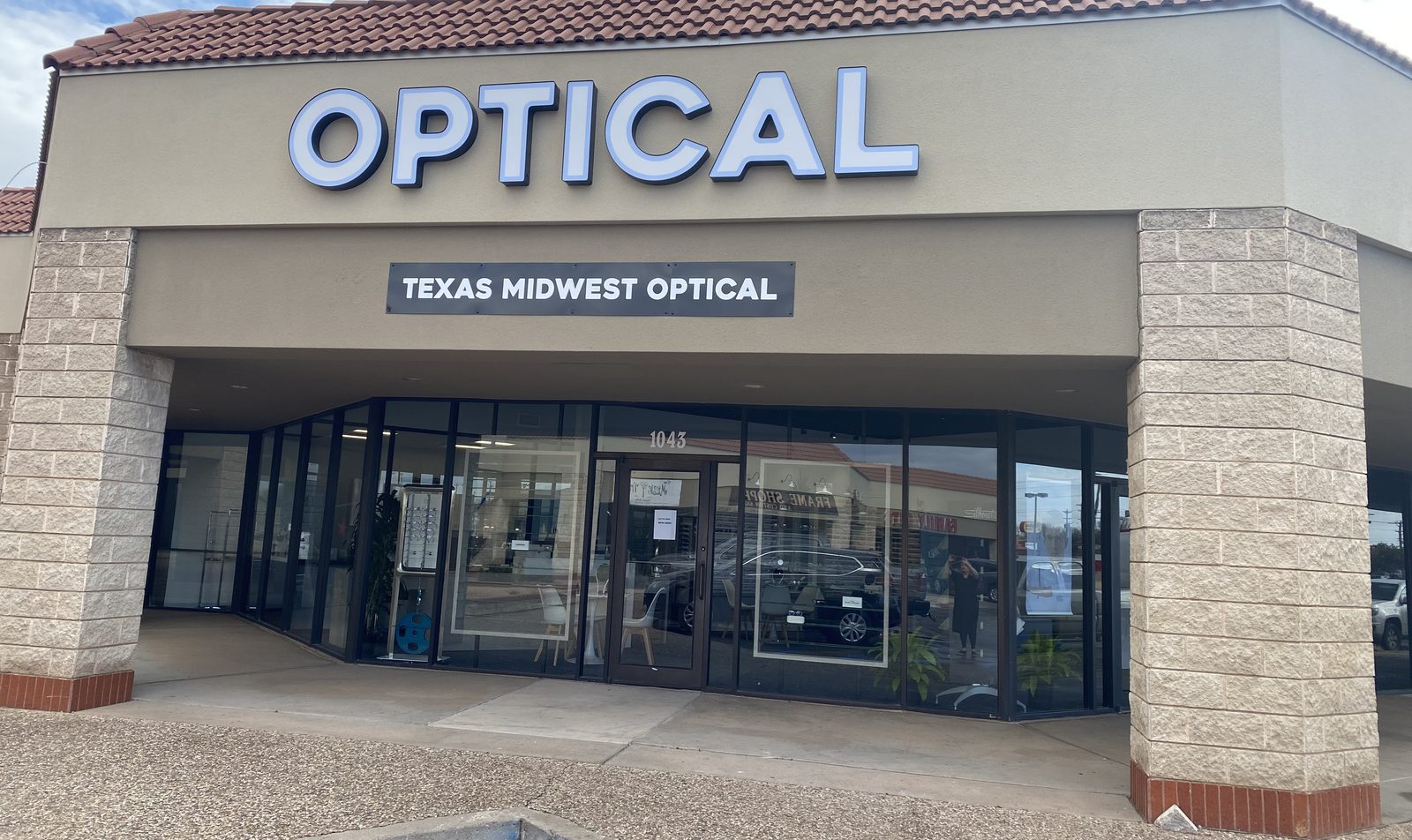 Front of Texas Midwest Optical with the OPTICAL sign and glass storefront